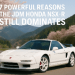 White JDM Honda NSX-R on a winding Japanese mountain road with cherry blossoms, featured in blog title 7 Powerful Reasons the JDM Honda NSX-R Still Dominates.