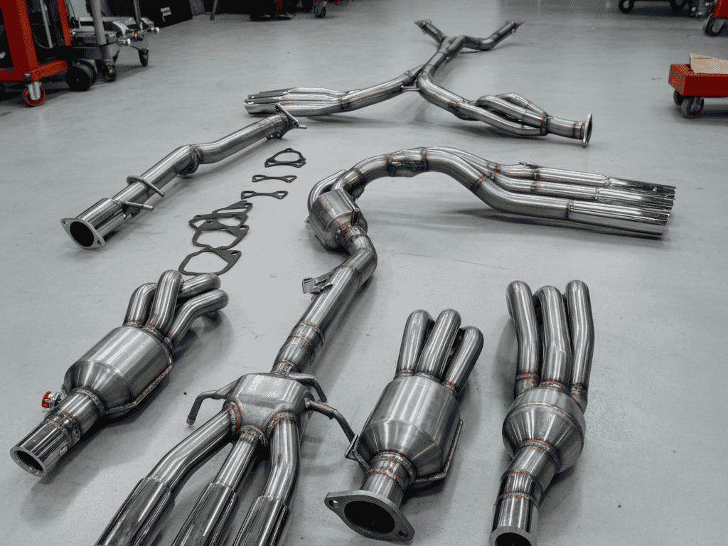 "Polished stainless steel JDM exhaust system including headers and cat-back."